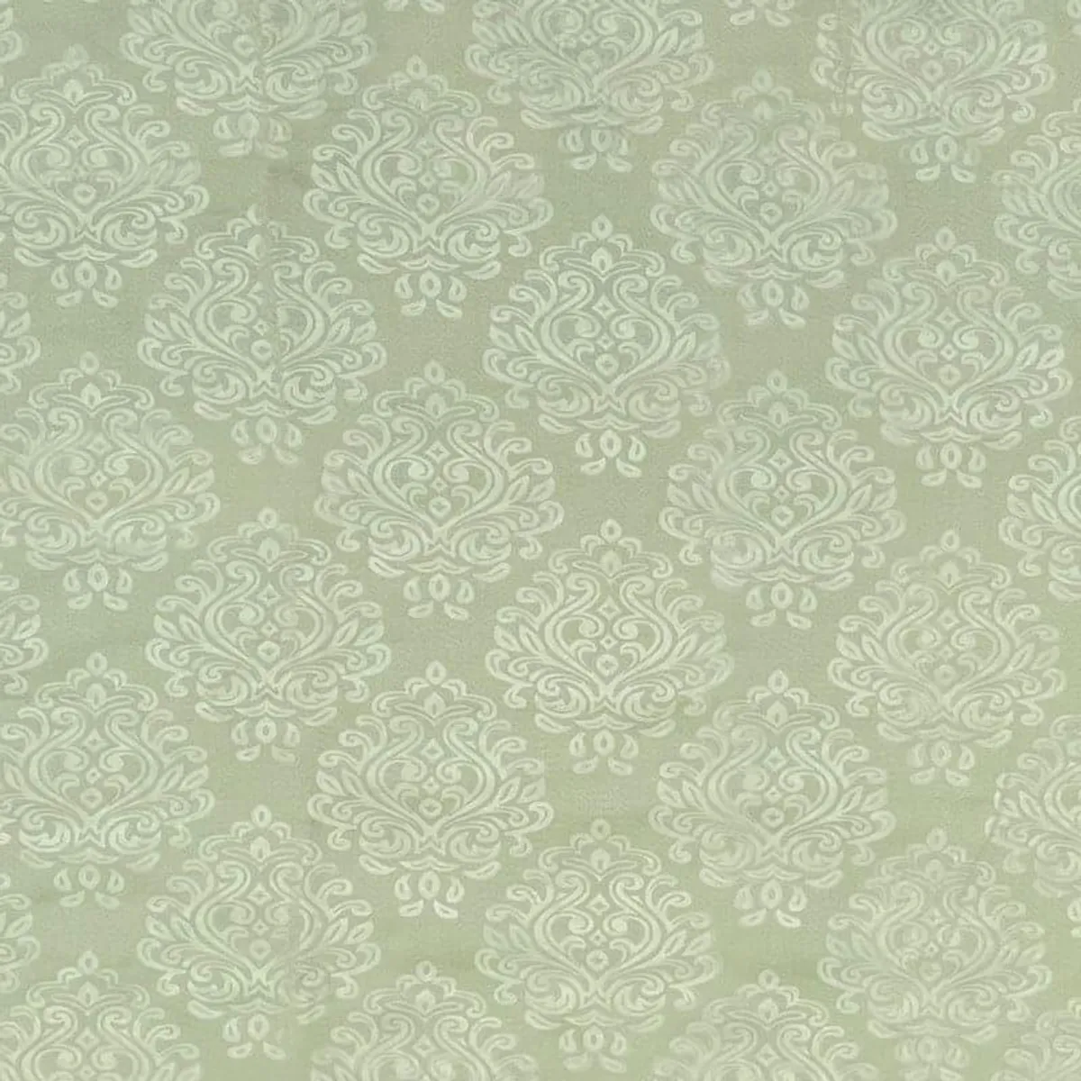 Close-up of the green curtains showing the repeating pale damask pattern