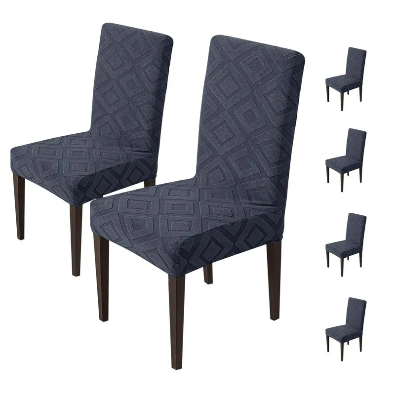 Set of black geometric elastic chair covers shown on dining chairs
