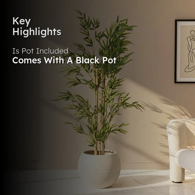 Artificial bamboo plant styled in a white planter in a living room