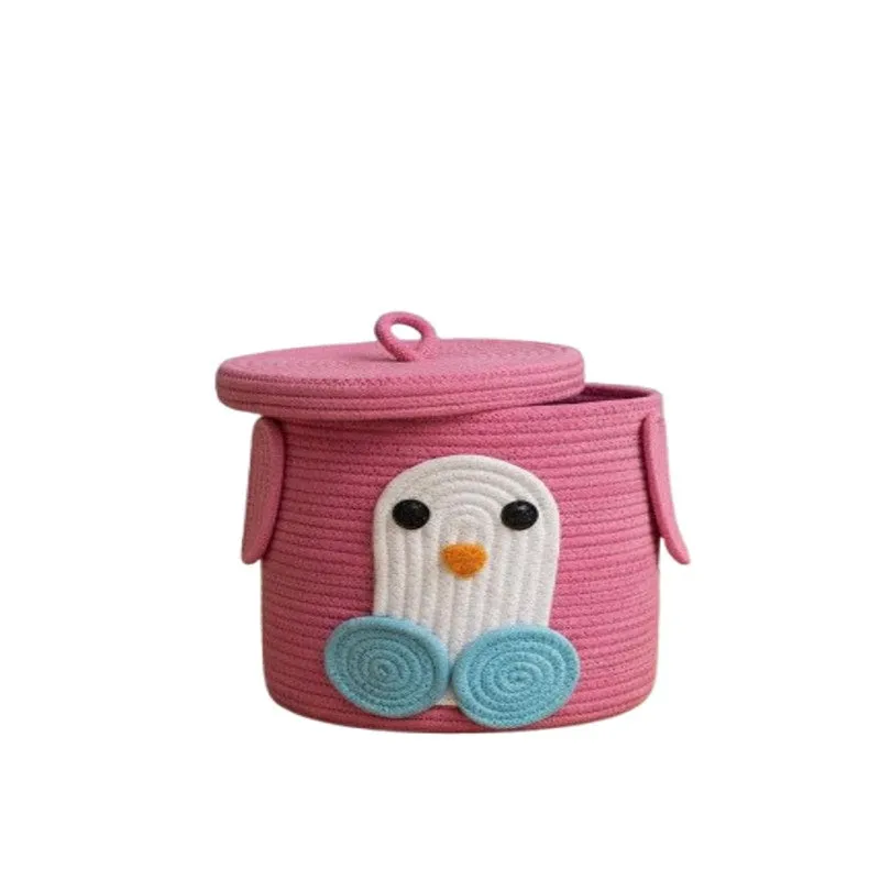 Pink penguin storage basket with lid on a plain white background