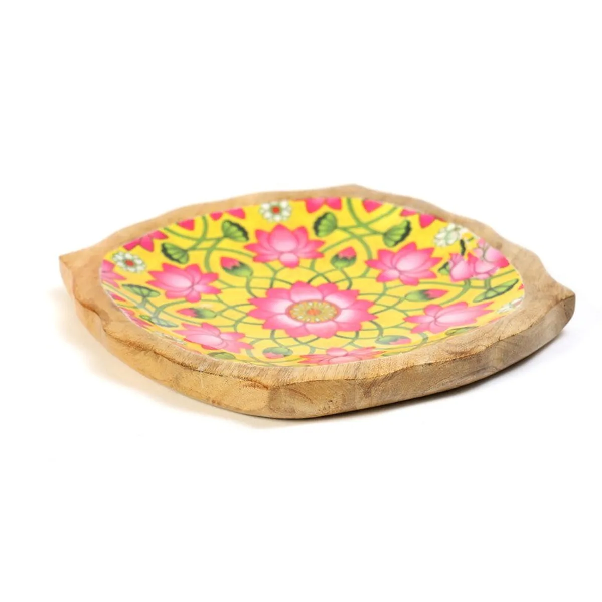 Side view of a thick free-form mango wood platter with floral centre