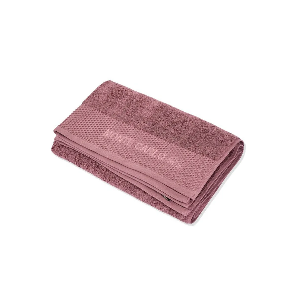 Folded dusty pink bath towel shown against a white background