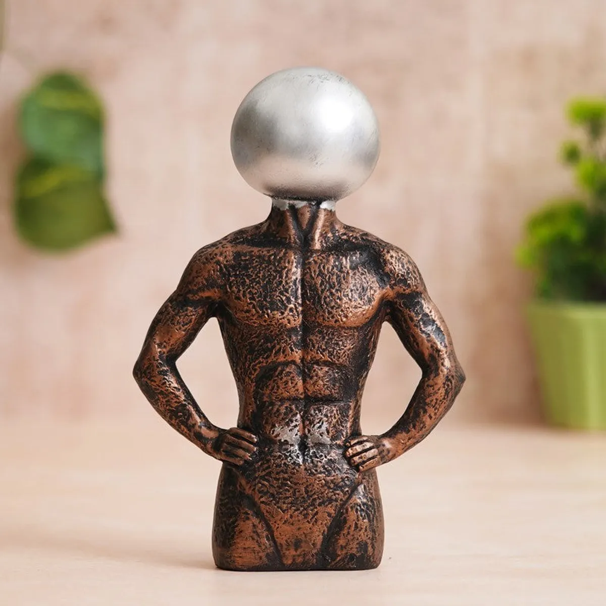 Front view of geometric man resin showpiece with metallic silver head