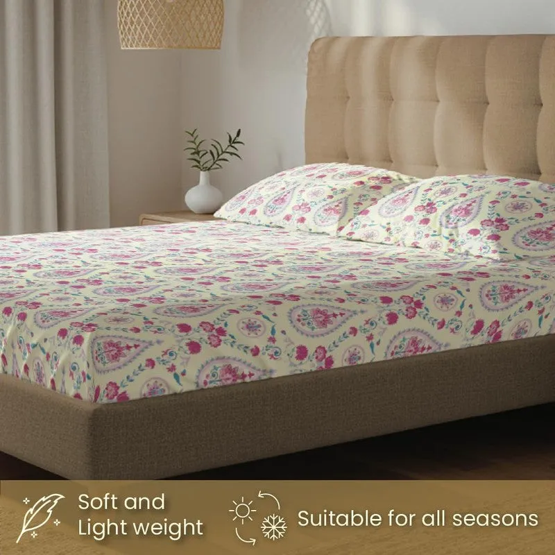 Printed multicolour bedding set styled on an upholstered bed