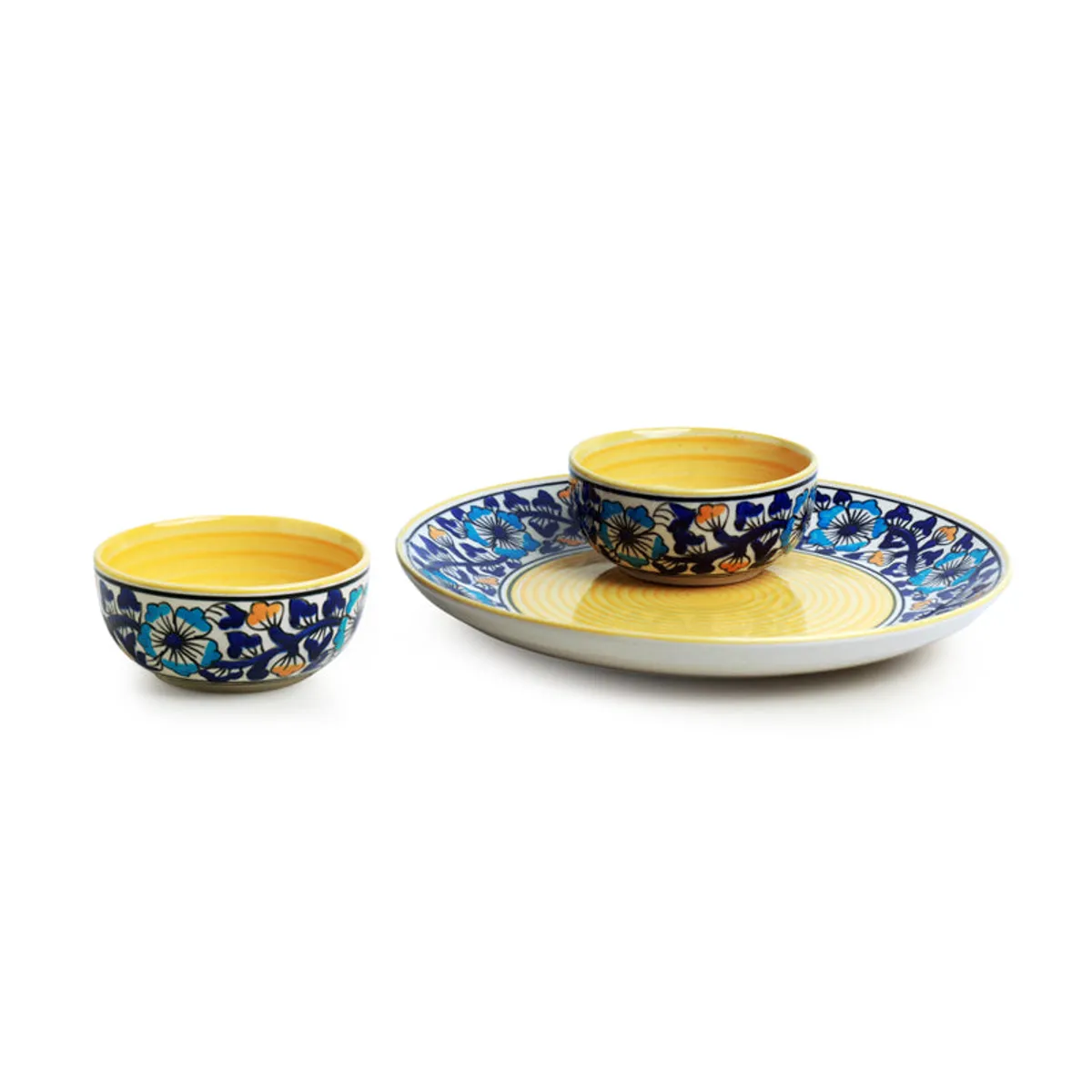 Three-piece blue floral ceramic dinner set displayed on a white background