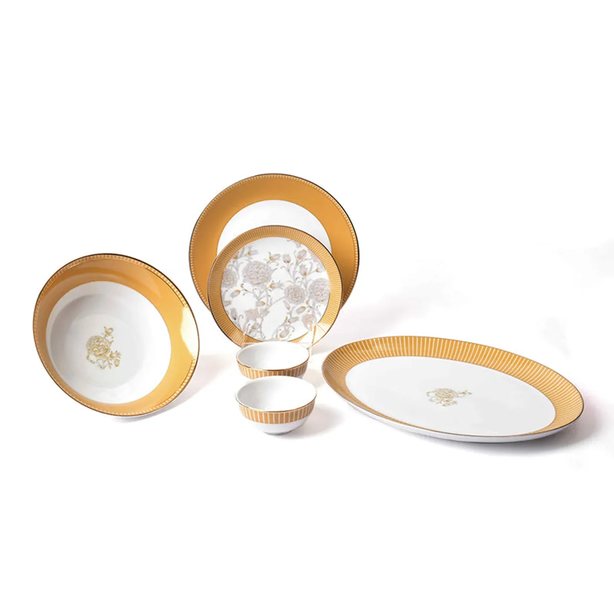 Mustard yellow and gold porcelain dinner set with plates, bowls and an oval platter