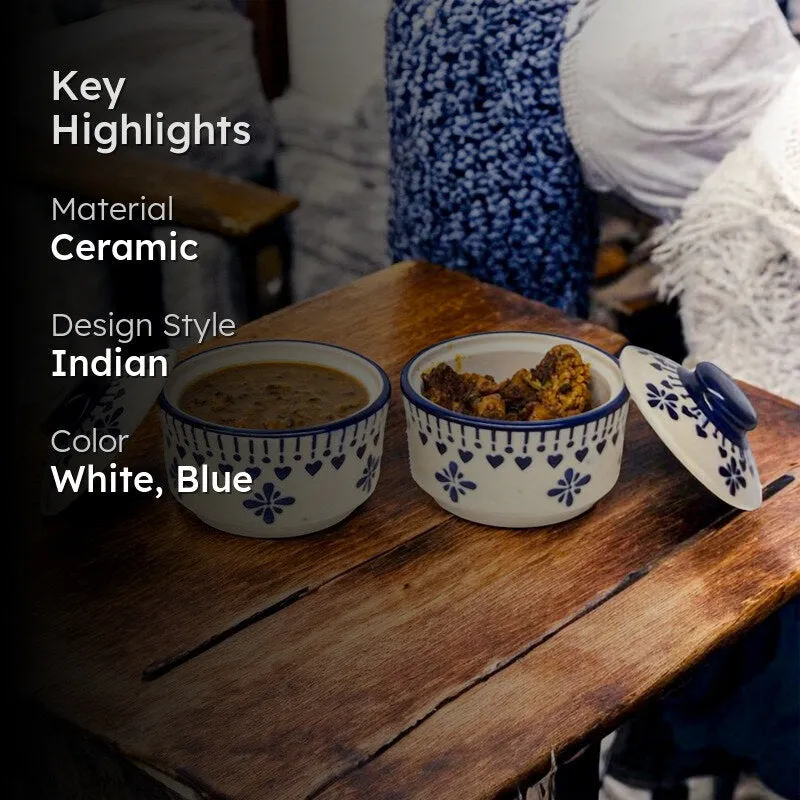 Blue and white ceramic serving bowls with lids on a wooden table