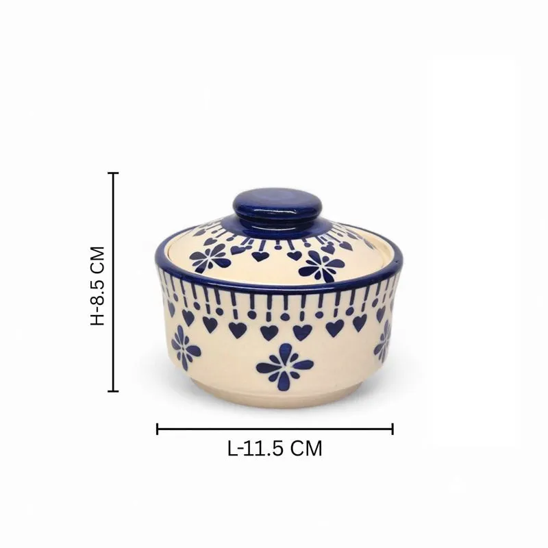 Single blue and white ceramic serving bowl with lid on white background