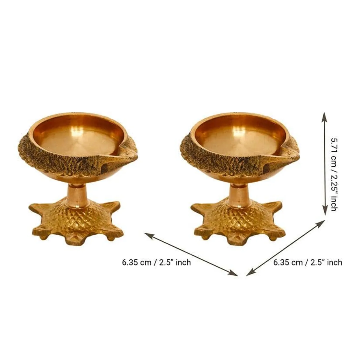 Two tortoise-shaped brass diyas shown against a white background
