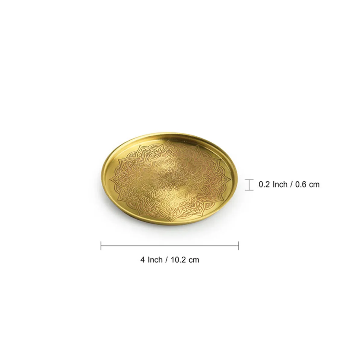 Single gold brass coaster with mandala detailing on a white background with guide lines.