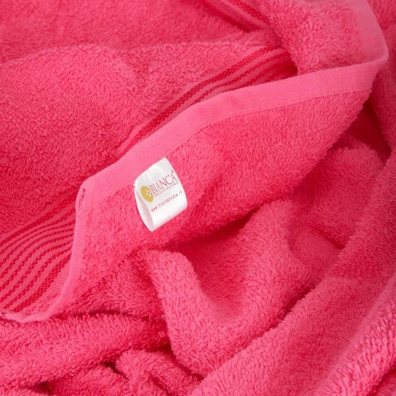 Close-up of bright red towel texture and folded edge