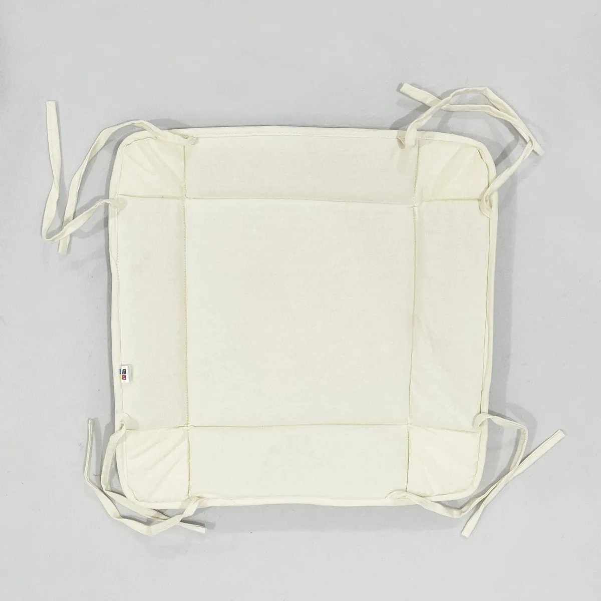 Flat lay of the bread basket opened out with corner ties visible