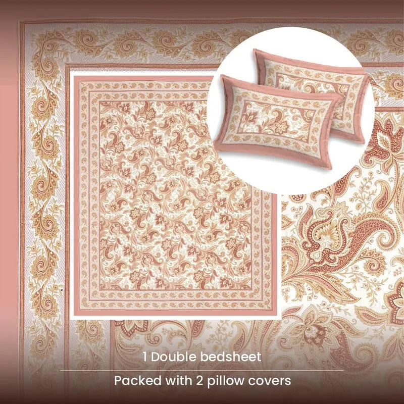 Flat lay of pink floral bedsheet with inset showing two matching pillow covers