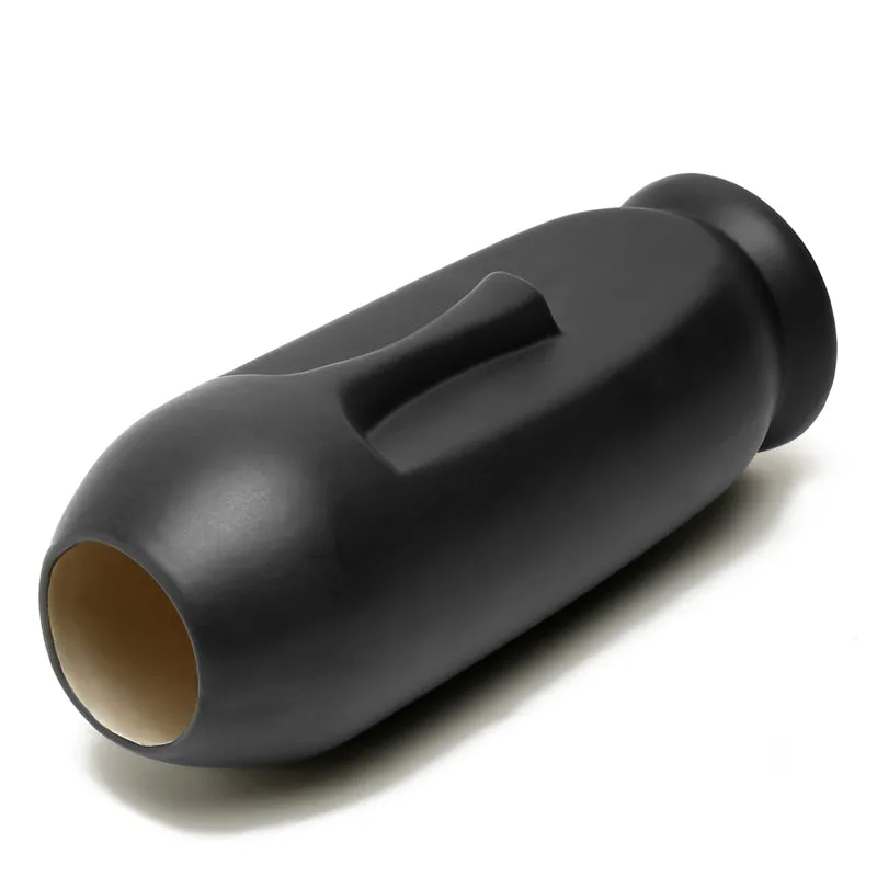 Matte black face vase shown lying on its side, revealing the hollow opening.
