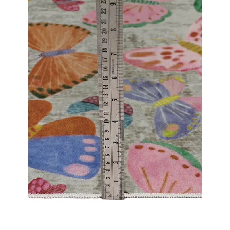 Close-up of butterfly carpet surface with a ruler placed vertically