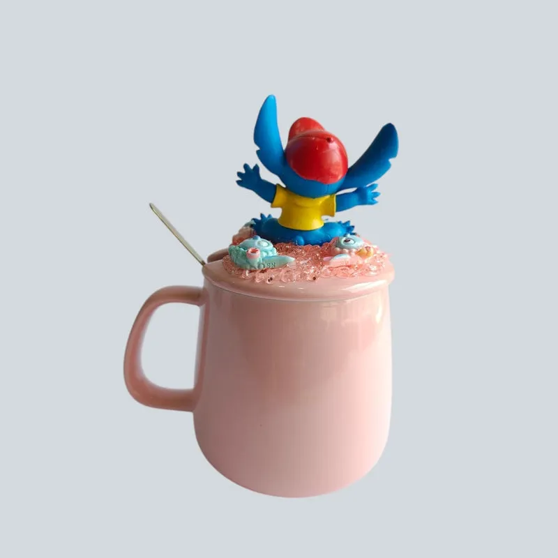 Side view of pink mug with decorative Stitch figurine lid and spoon
