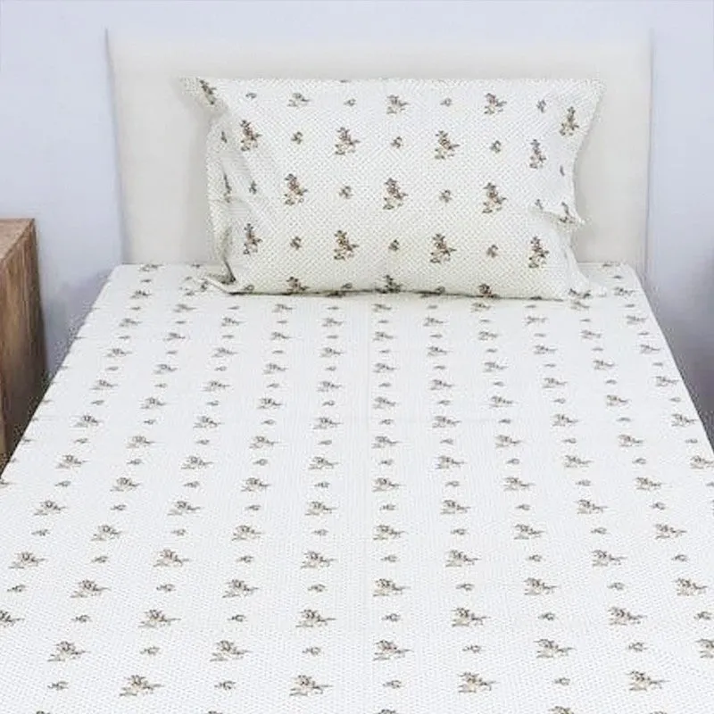 Front view of floral bedsheet and matching pillow cover on a bed