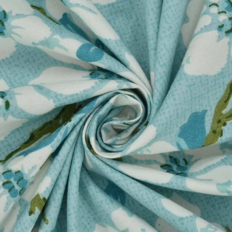 Close-up of blue floral micro fiber fabric gathered in a swirl