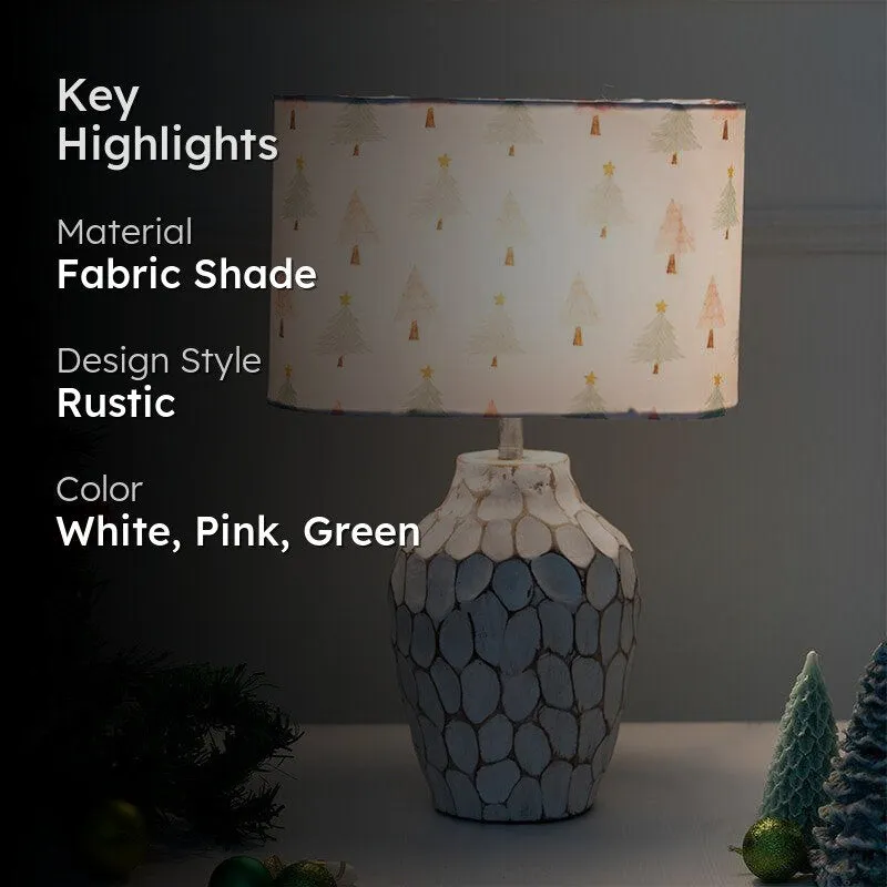 Glowing Christmas table lamp with festive printed shade and textured base