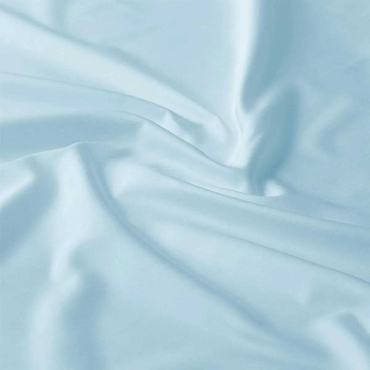 Close-up of the pale blue fabric with soft folds.