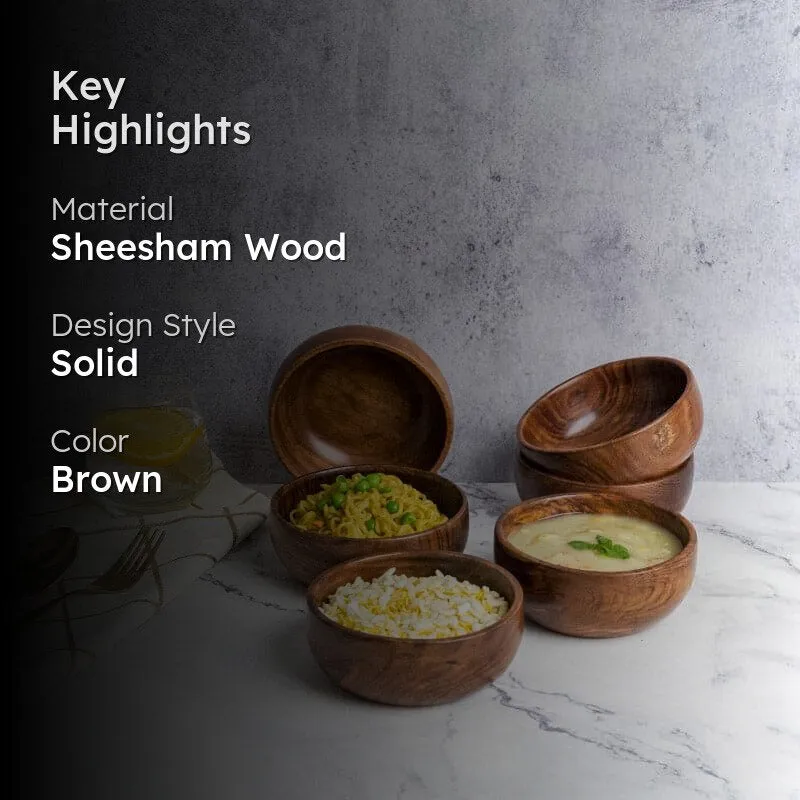 Brown wooden bowls with food styled on a tabletop