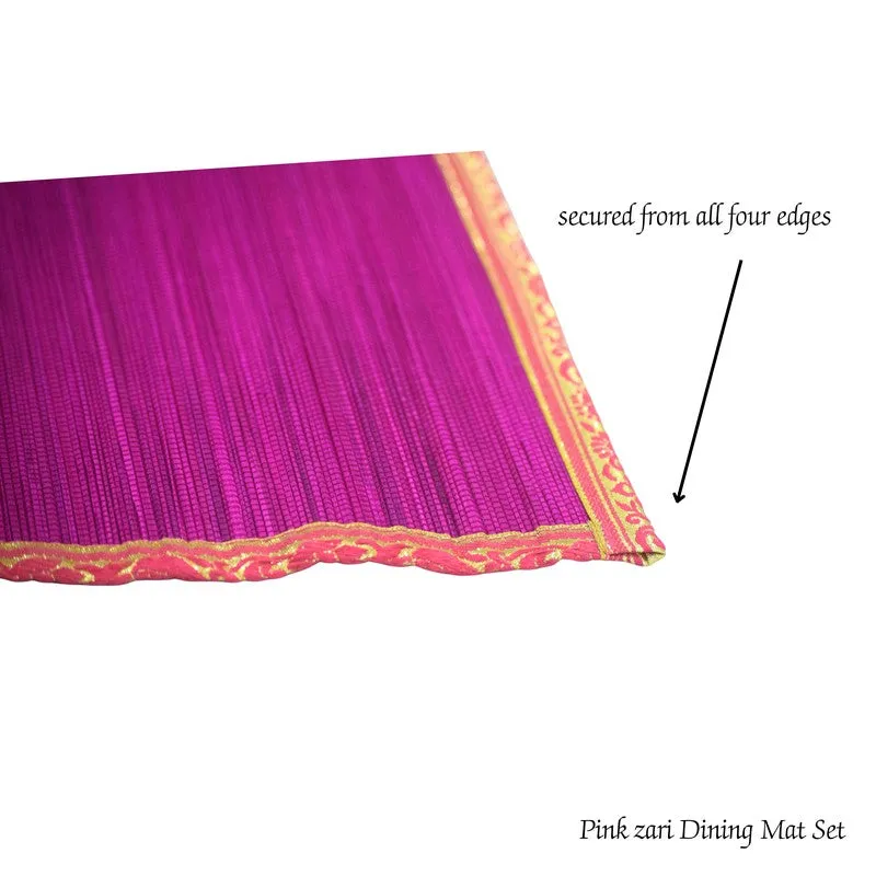 Close-up of the pink runner's textured surface and gold zari edging