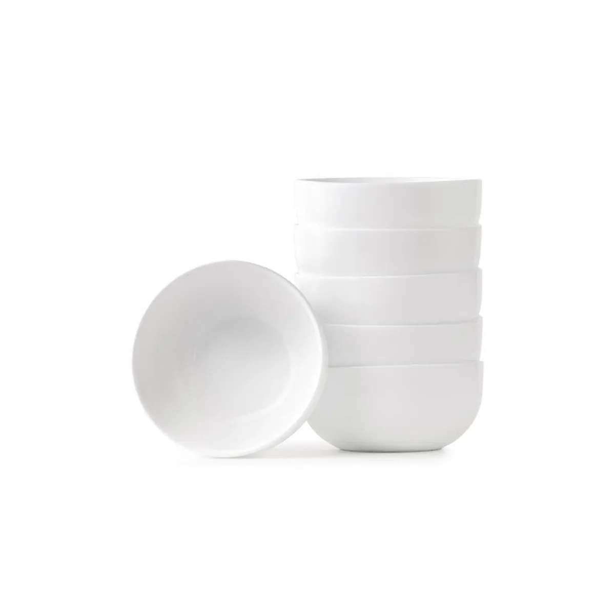 Six white snack bowls stacked together with one bowl facing forward