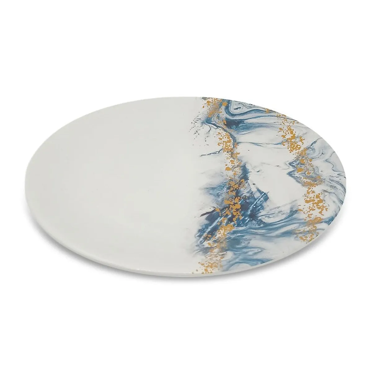 Single white round dinner plate with blue and gold marbled detailing shown from an angle