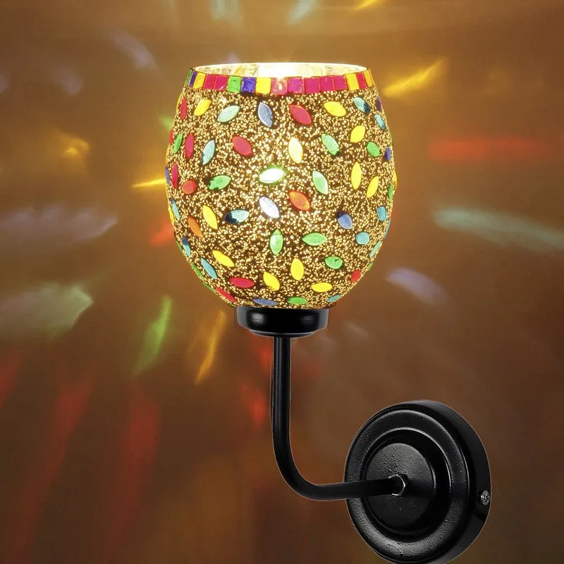 Close view of illuminated mosaic glass wall lamp with black iron mount