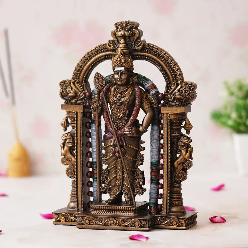 Three-quarter view of a detailed Vel Murugan idol and sculpted arch