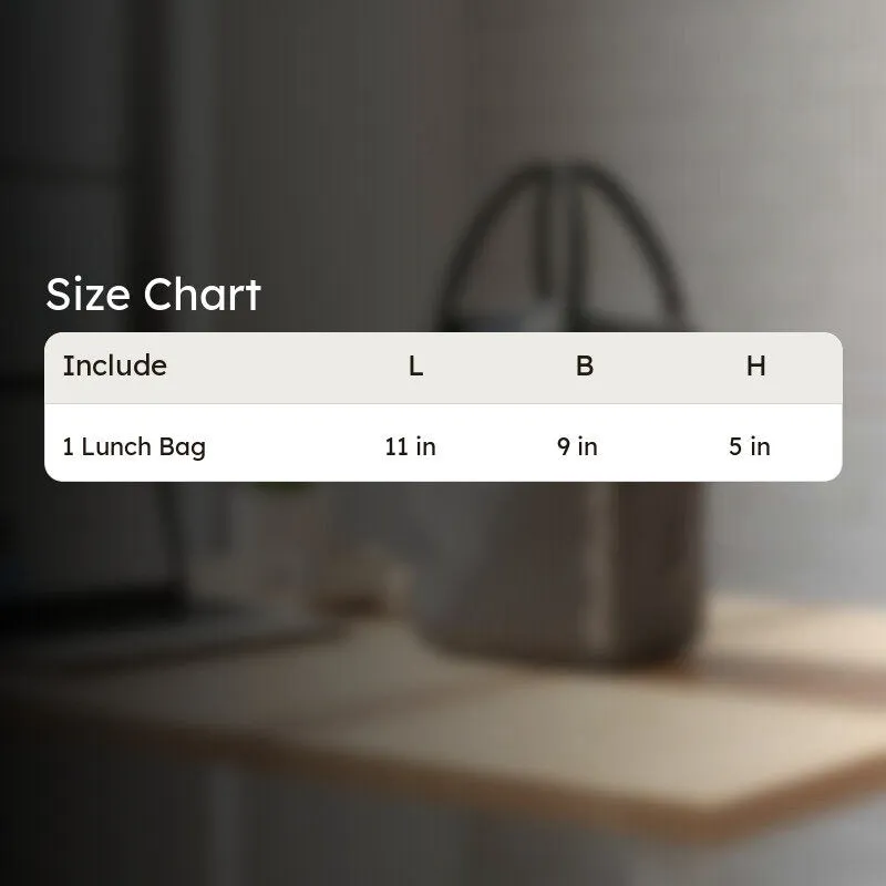 Grey lunch bag shown beside a size chart on a desk