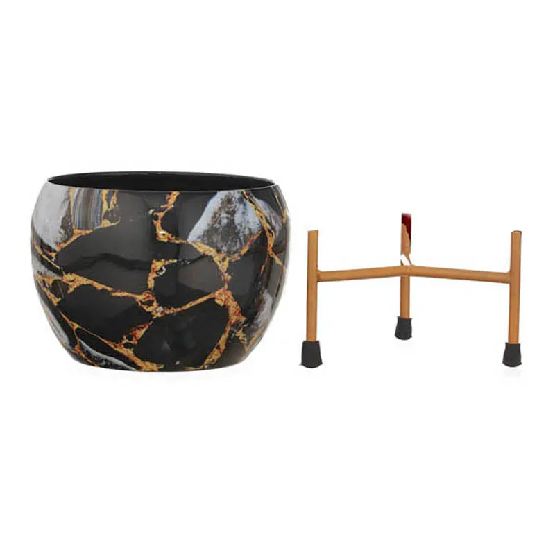 Black marbled planter with gold veining beside its matching stand on a white background