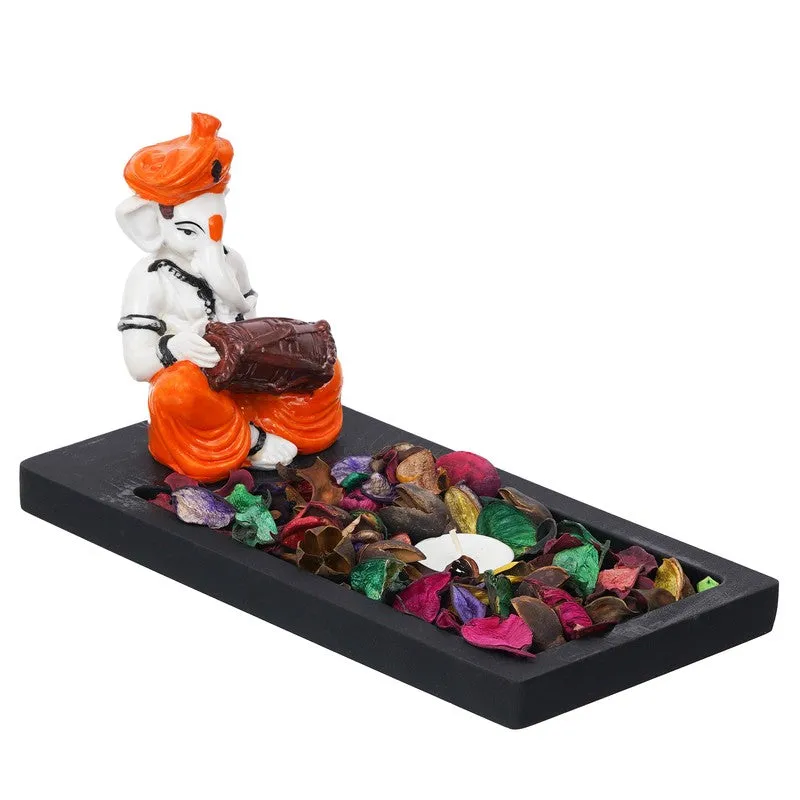 Studio view of Ganesha tea light holder on a rectangular black base