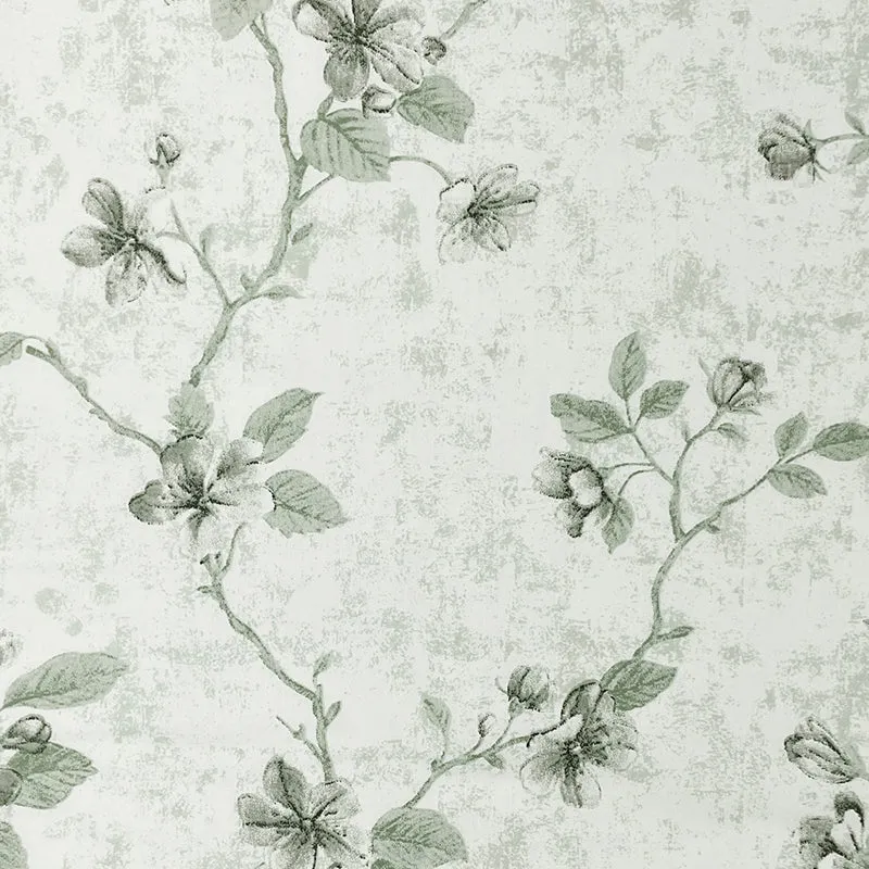 Close-up of beige and green floral print on the bedsheet fabric