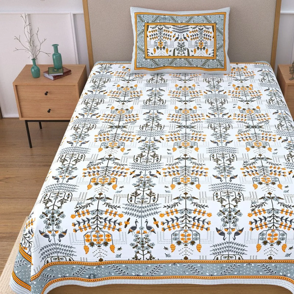 Close view of floral bedsheet and matching pillow cover in blue, yellow and white