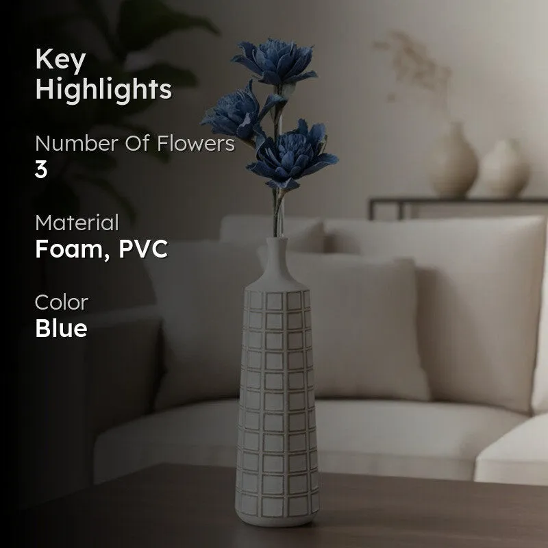 Blue artificial dahlia arrangement shown in a white geometric vase.