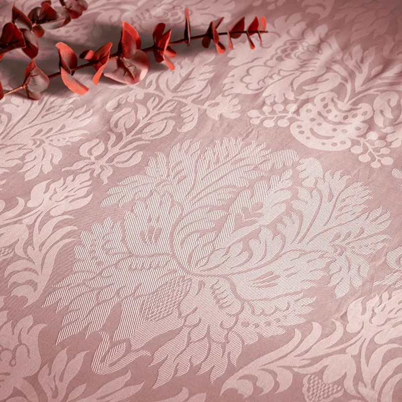 Close-up of the duvet cover showing its pale floral motif and textured pattern.