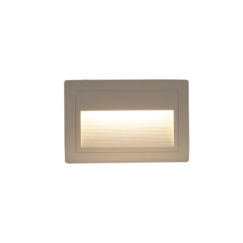 White rectangular step light illuminated with a warm glow