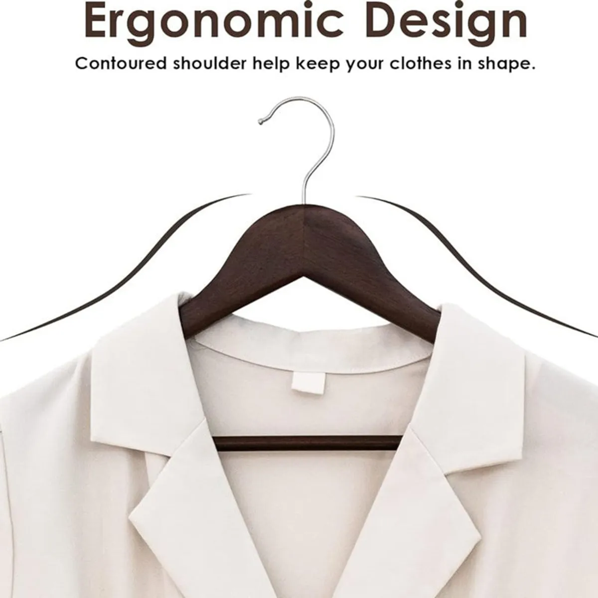 Single dark brown wooden hanger holding a white shirt