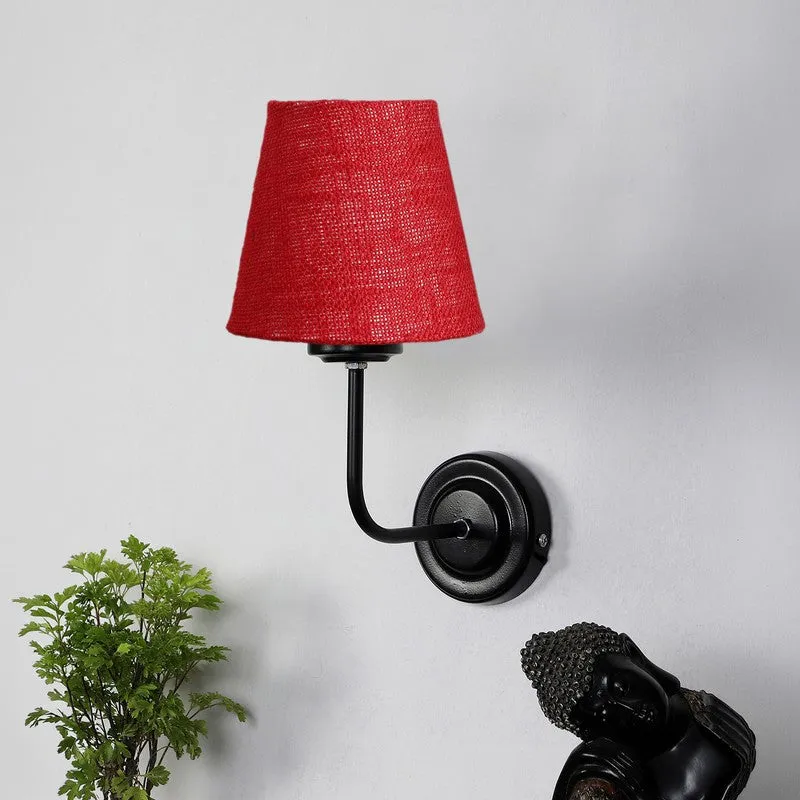 Close view of red jute wall lamp with black round iron base