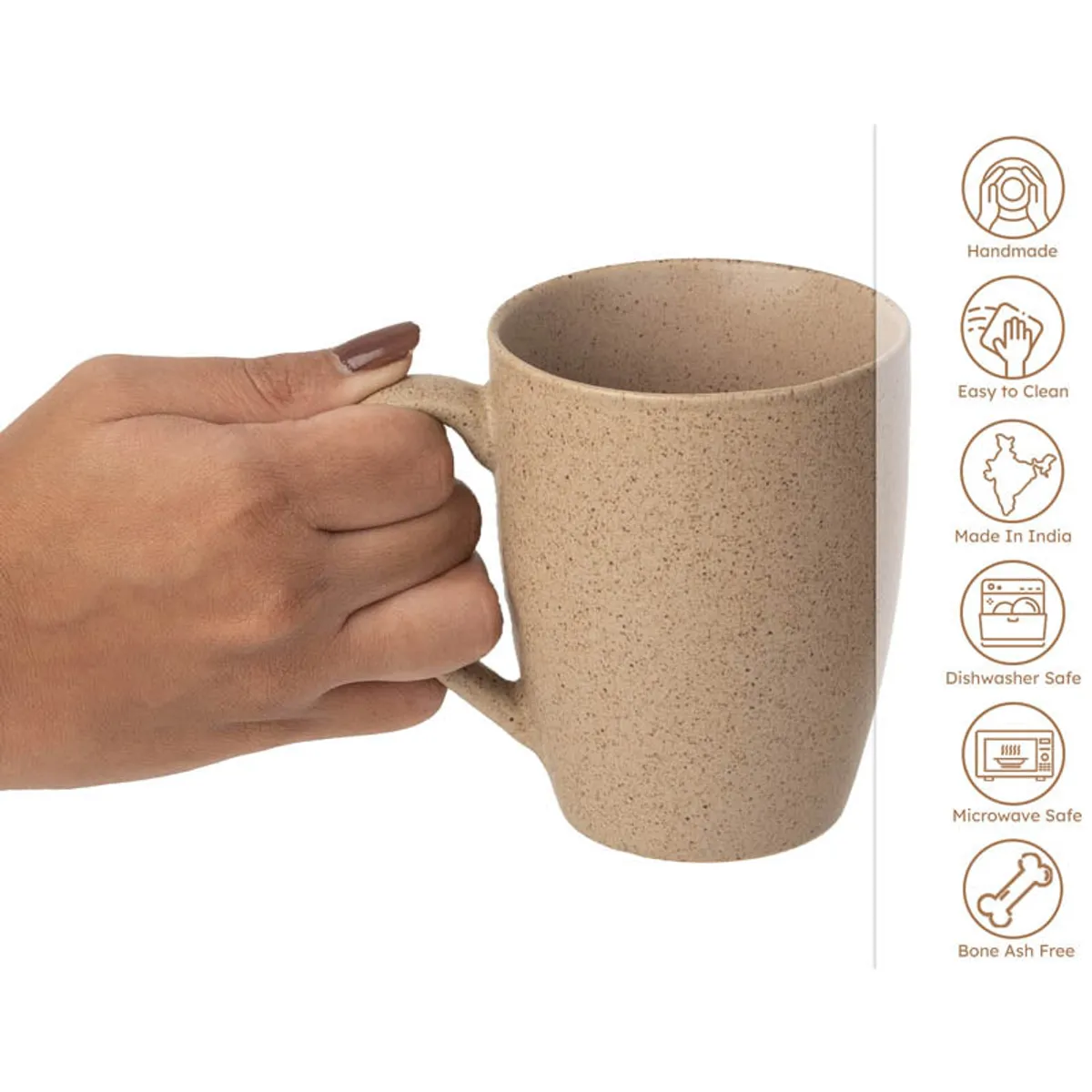 Close-up of a brown ceramic mug being held by its handle