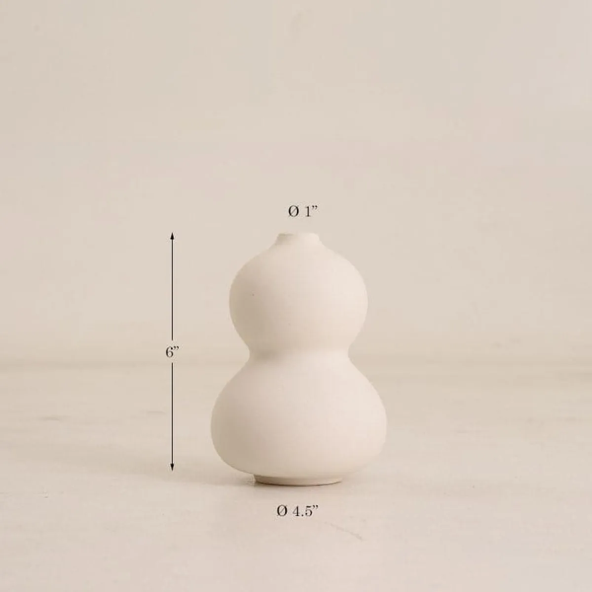 White bubble vase shown against a plain light background