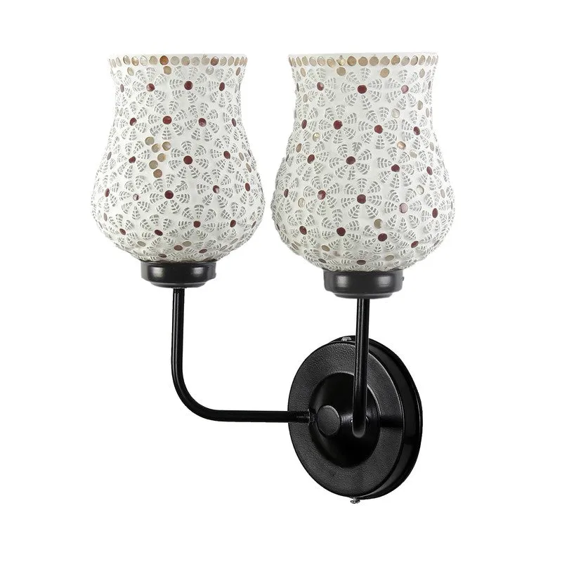 Angled view of twin ivory mosaic glass wall lamp with black iron base