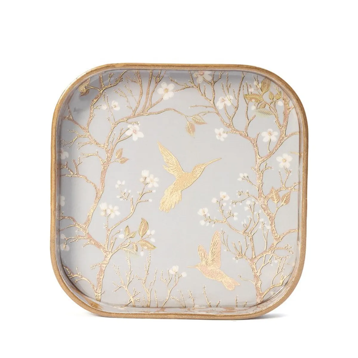 Close-up of a grey tray with gold birds, branches and floral detailing