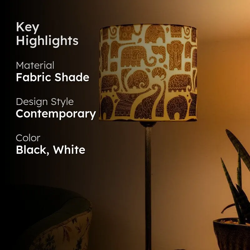 Close view of lit elephant print table lamp with key highlights text overlay