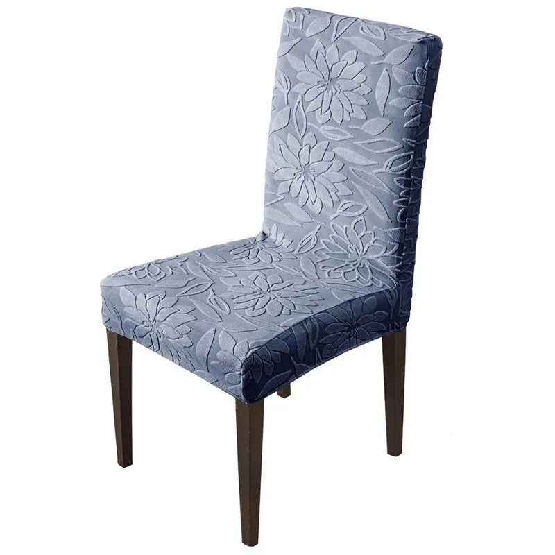 Blue floral chair cover fitted on a dining chair against a white background