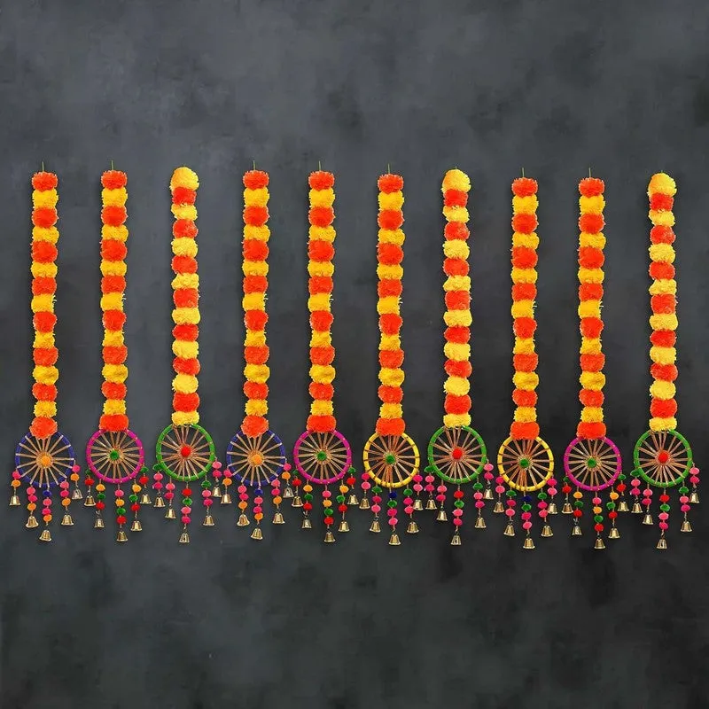 Multiple marigold latkans with colourful chakra bases displayed against a dark background