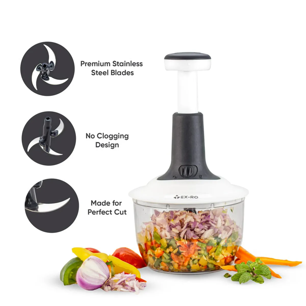 Manual chopper with stainless steel blades and chopped colourful vegetables in its clear bowl