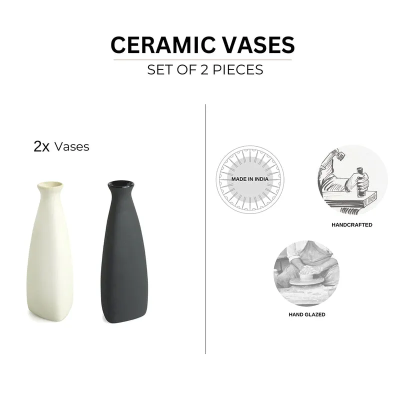 Pair of tapered vases in white and black on a white background