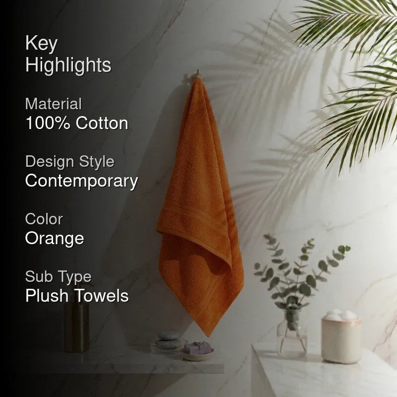 Orange bath towel styled in a bathroom with key highlights overlay